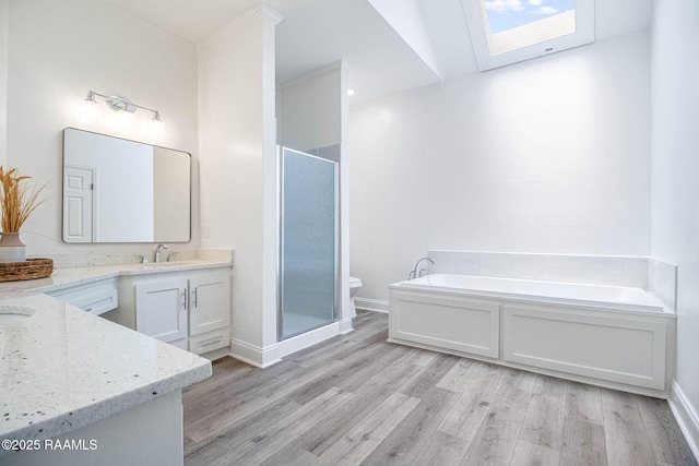 806 Beaujolais Pkwy, Lafayette, LA 70503 - full bath with a skylight, vanity, a shower stall, wood finished floors, and crown molding