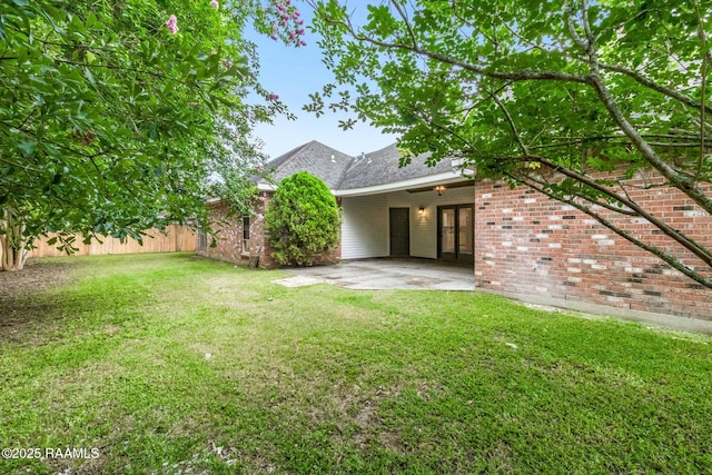 806 Beaujolais Pkwy, Lafayette, LA 70503 - view of yard featuring french doors and a patio area