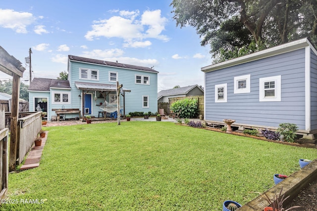 234 Ridgewood St, Lafayette, LA 70506 - back of property featuring a fenced backyard and a patio