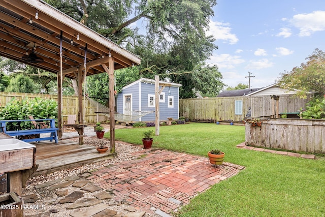 234 Ridgewood St, Lafayette, LA 70506 - fenced backyard featuring an outbuilding, a patio, and a wooden deck
