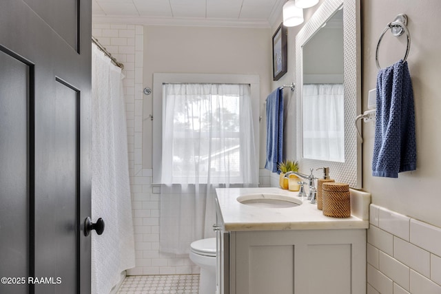 234 Ridgewood St, Lafayette, LA 70506 - full bathroom featuring vanity, ornamental molding, tile walls, and a shower with curtain