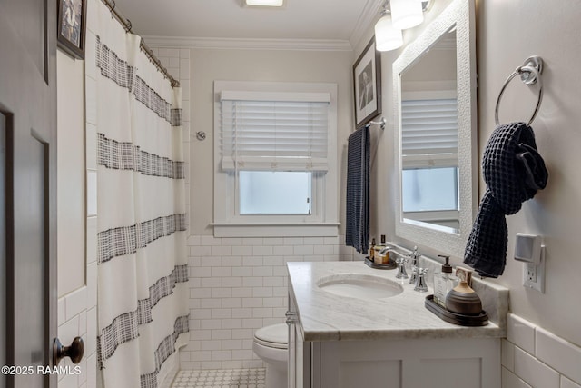 234 Ridgewood St, Lafayette, LA 70506 - full bathroom featuring tile walls, ornamental molding, vanity, tile patterned floors, and a shower with curtain