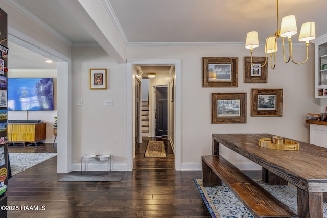 234 Ridgewood St, Lafayette, LA 70506 - hallway with dark wood-type flooring, crown molding, a chandelier, and stairway