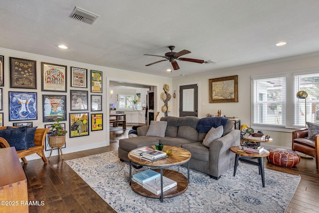 234 Ridgewood St, Lafayette, LA 70506 - living room with crown molding, plenty of natural light, dark wood-style floors, a ceiling fan, and recessed lighting