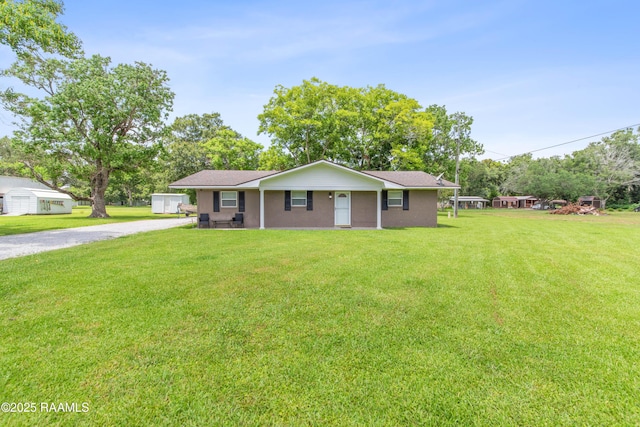 1329-B Grand Anse Hwy, Breaux Bridge, LA 70517 - ranch-style house featuring a front lawn and gravel driveway