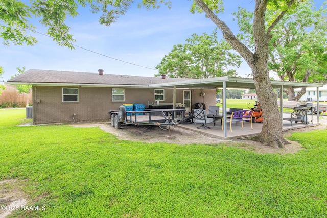 1329-B Grand Anse Hwy, Breaux Bridge, LA 70517 - back of property with a patio, a yard, brick siding, and an outdoor living space