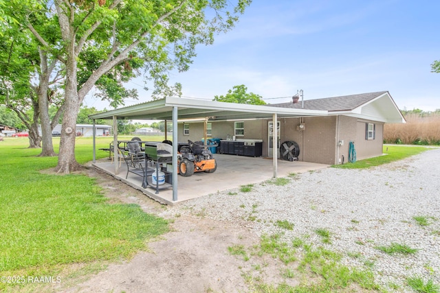 1329-B Grand Anse Hwy, Breaux Bridge, LA 70517 - view of patio / terrace featuring an attached carport