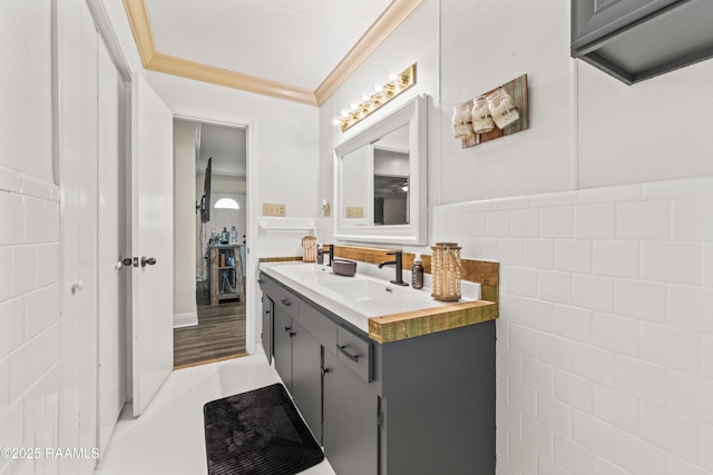 1329-B Grand Anse Hwy, Breaux Bridge, LA 70517 - bathroom with vanity, tile walls, crown molding, and wainscoting