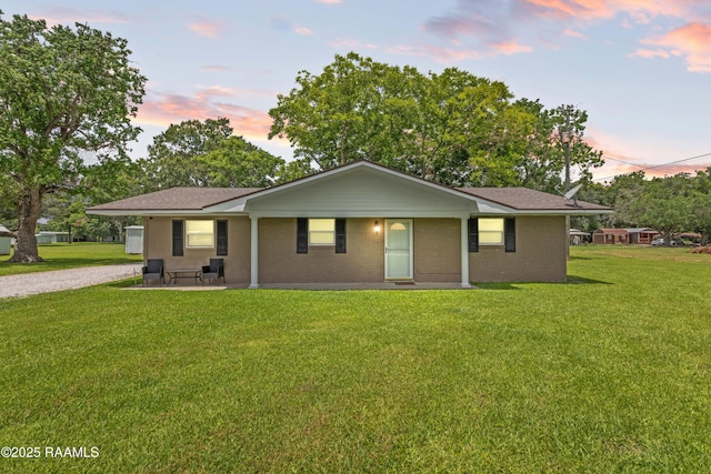 1329-B Grand Anse Hwy, Breaux Bridge, LA 70517 - ranch-style house with a lawn, brick siding, and a patio area