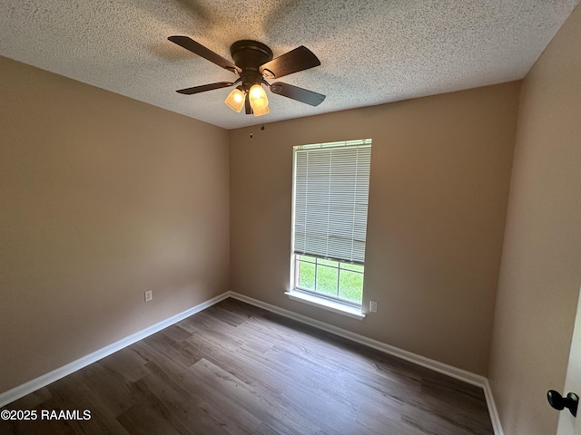 7226 Meadowview Ave, Baton Rouge, LA 70810 - spare room featuring dark wood-style flooring, a textured ceiling, and ceiling fan