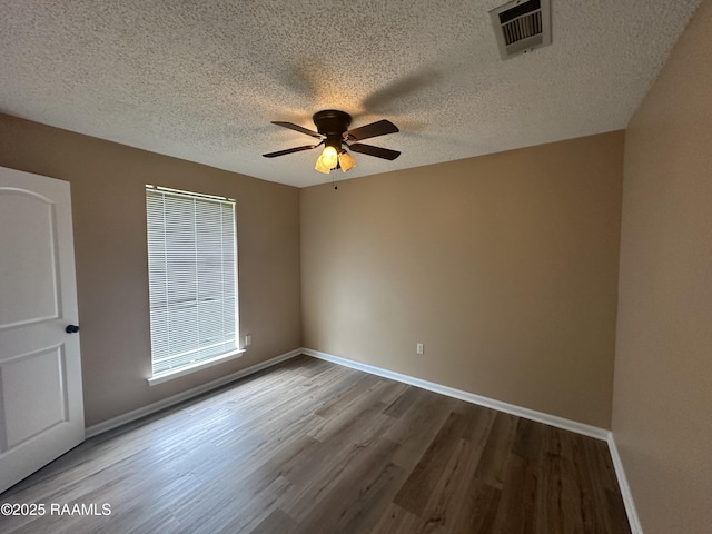 7226 Meadowview Ave, Baton Rouge, LA 70810 - empty room featuring wood finished floors, ceiling fan, and a textured ceiling