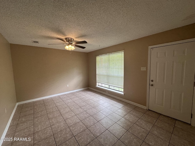 7226 Meadowview Ave, Baton Rouge, LA 70810 - tiled spare room featuring a ceiling fan and a textured ceiling