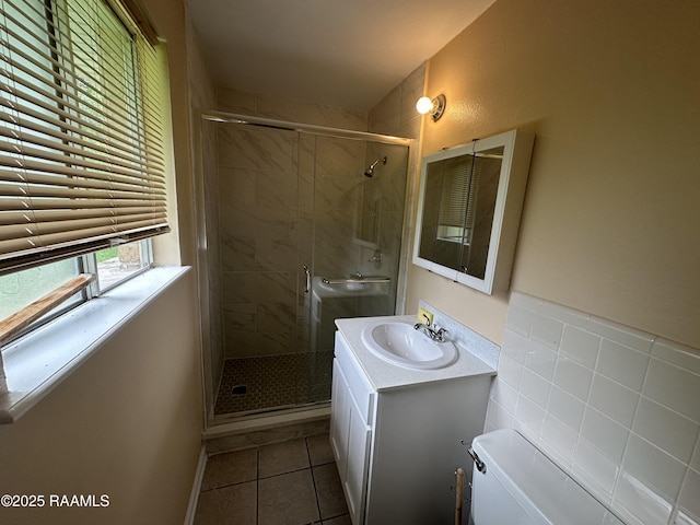 7226 Meadowview Ave, Baton Rouge, LA 70810 - bathroom with tile patterned flooring, a stall shower, and vanity