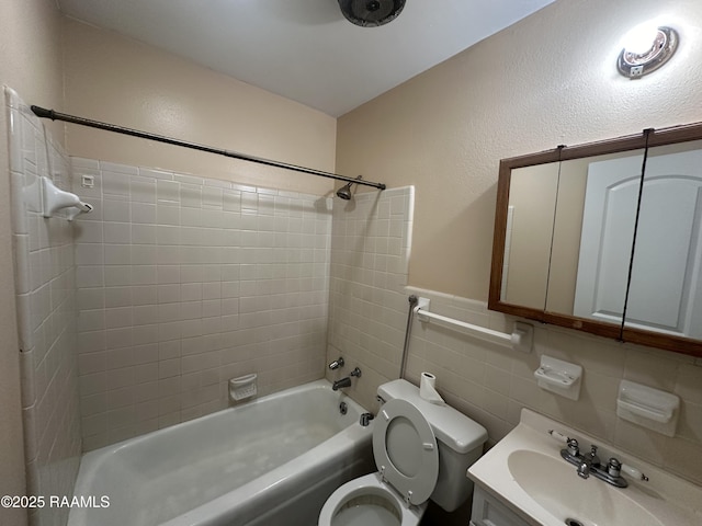 7226 Meadowview Ave, Baton Rouge, LA 70810 - bathroom with  shower combination, vanity, tile walls, and a wainscoted wall