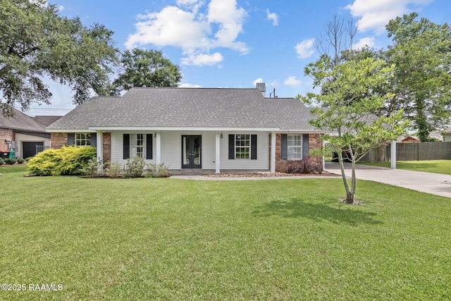 921 Bellevue Plantation Rd, Lafayette, LA 70503 - view of front facade with french doors, driveway, roof with shingles, and brick siding