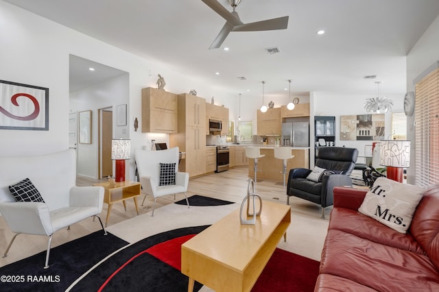 3703 Daspit Rd, New Iberia, LA 70563 - living room with a ceiling fan, recessed lighting, and light wood-style floors