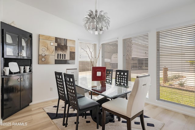 3703 Daspit Rd, New Iberia, LA 70563 - dining space with a chandelier and light wood-type flooring