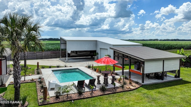 3703 Daspit Rd, New Iberia, LA 70563 - rear view of house featuring agricultural plots, a view of rural / pastoral area, a carport, and a metal roof