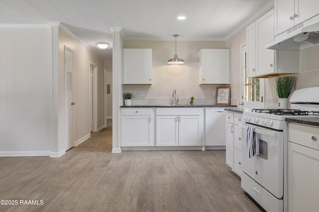 109 Guadalajara St, New Iberia, LA 70563 - kitchen featuring white appliances, under cabinet range hood, crown molding, dark countertops, and white cabinetry