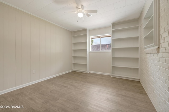 109 Guadalajara St, New Iberia, LA 70563 - spare room featuring wood finished floors, a ceiling fan, and crown molding
