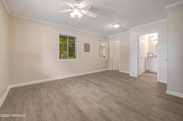 109 Guadalajara St, New Iberia, LA 70563 - spare room featuring wood finished floors, crown molding, a ceiling fan, and electric panel