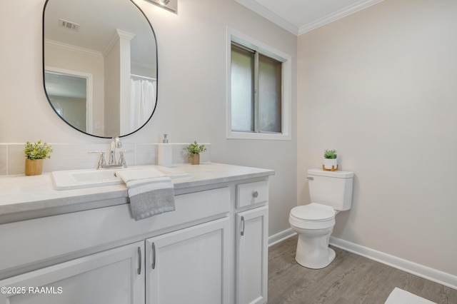 109 Guadalajara St, New Iberia, LA 70563 - bathroom with vanity, wood finished floors, and ornamental molding