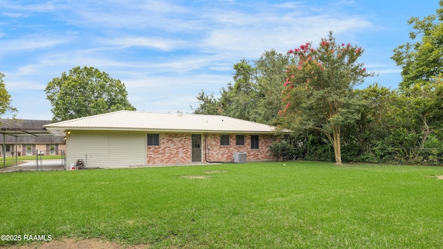 109 Guadalajara St, New Iberia, LA 70563 - back of house with a carport and brick siding