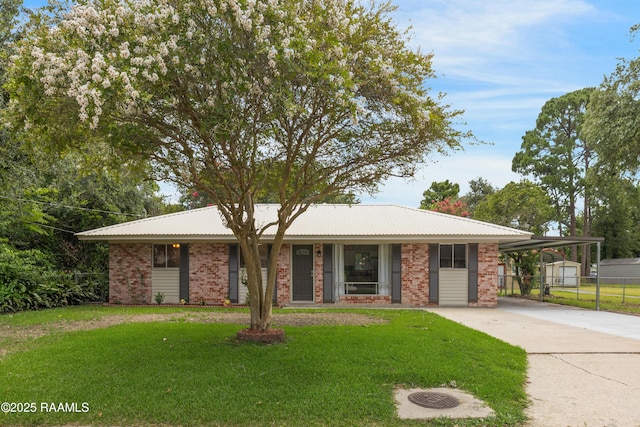 109 Guadalajara St, New Iberia, LA 70563 - single story home with concrete driveway, brick siding, and an attached carport