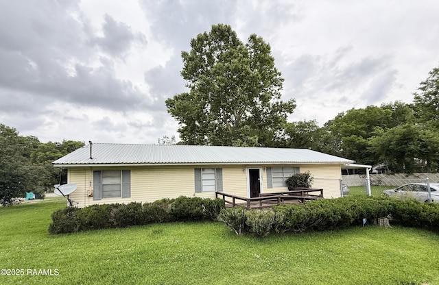 122 Buckner Rd, Eunice, LA 70535 - view of front of home with a metal roof and a deck