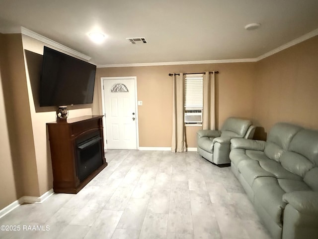 122 Buckner Rd, Eunice, LA 70535 - living room featuring ornamental molding, light wood finished floors, and cooling unit