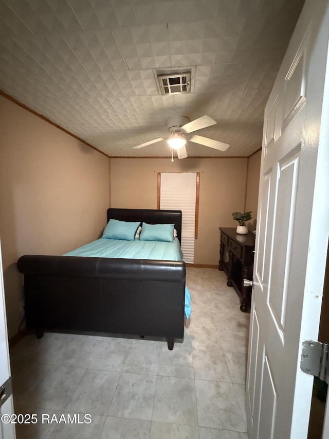 122 Buckner Rd, Eunice, LA 70535 - bedroom with a ceiling fan and light tile patterned flooring