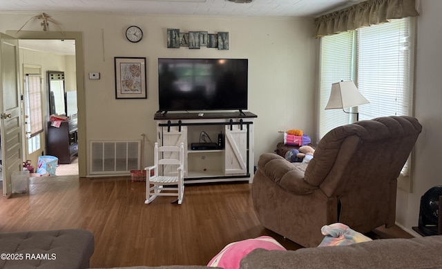 3492 Bayou Gerimond Rd, Port Barre, LA 70577 - living area with wood finished floors, plenty of natural light, and ornamental molding