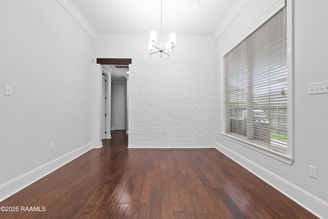 106 Whitewater Dr, Broussard, LA 70518 - unfurnished dining area with a chandelier, wood finished floors, crown molding, and brick wall