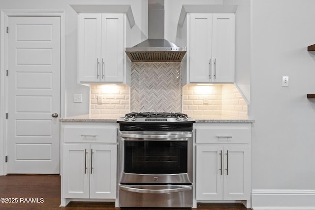 106 Whitewater Dr, Broussard, LA 70518 - kitchen featuring stainless steel range with gas stovetop, wall chimney range hood, tasteful backsplash, and white cabinetry