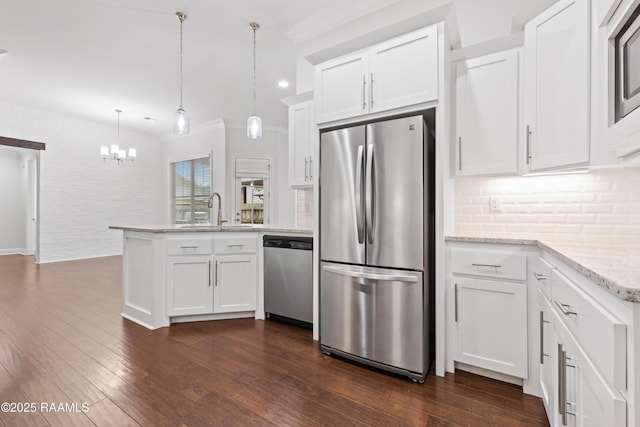 106 Whitewater Dr, Broussard, LA 70518 - kitchen featuring appliances with stainless steel finishes, a peninsula, decorative backsplash, a chandelier, and white cabinets