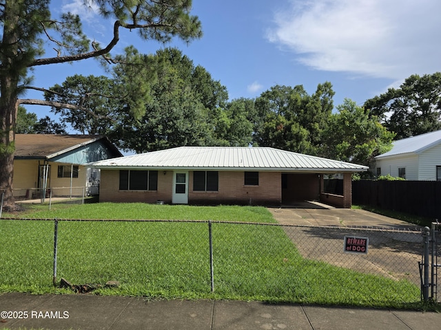 119 Romero St, Youngsville, LA 70592 - single story home with a carport, brick siding, a fenced front yard, and a metal roof