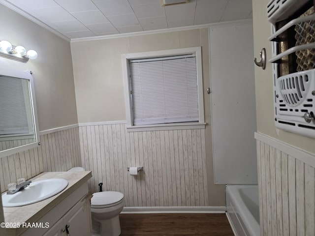 119 Romero St, Youngsville, LA 70592 - full bath featuring vanity, wood finished floors, a tub, crown molding, and wainscoting