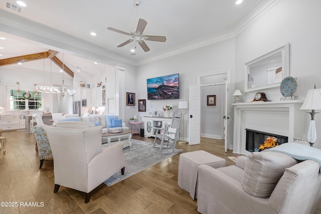 403 Catalina Ln, Youngsville, LA 70592 - living area featuring a ceiling fan, recessed lighting, a glass covered fireplace, light wood-style floors, and crown molding