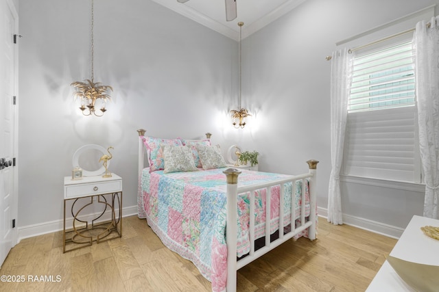 403 Catalina Ln, Youngsville, LA 70592 - bedroom with wood finished floors, ornamental molding, and a chandelier