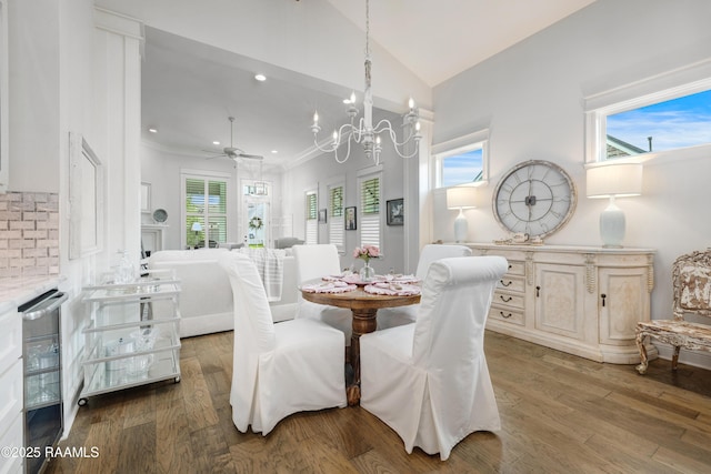 403 Catalina Ln, Youngsville, LA 70592 - dining area featuring ceiling fan, wood finished floors, lofted ceiling, wine cooler, and a chandelier