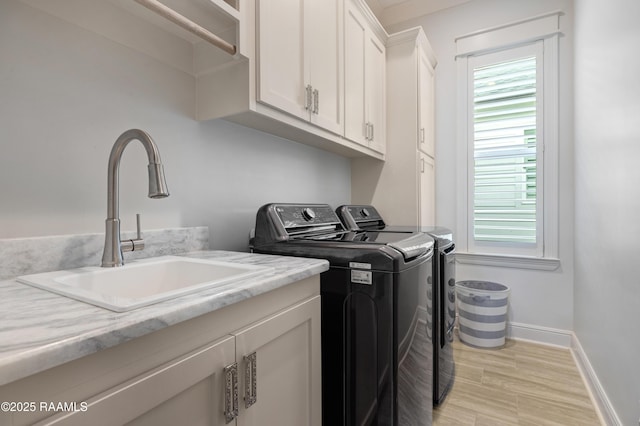403 Catalina Ln, Youngsville, LA 70592 - washroom featuring separate washer and dryer and cabinet space