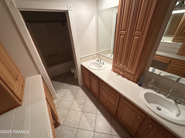 14439 Gladu Rd, Kaplan, LA 70548 - bathroom with double vanity and tile patterned flooring