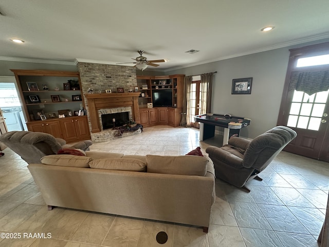 14439 Gladu Rd, Kaplan, LA 70548 - living area with plenty of natural light, ornamental molding, a ceiling fan, a brick fireplace, and recessed lighting