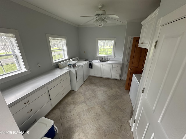 14439 Gladu Rd, Kaplan, LA 70548 - laundry room featuring cabinet space, healthy amount of natural light, washer and dryer, crown molding, and a ceiling fan