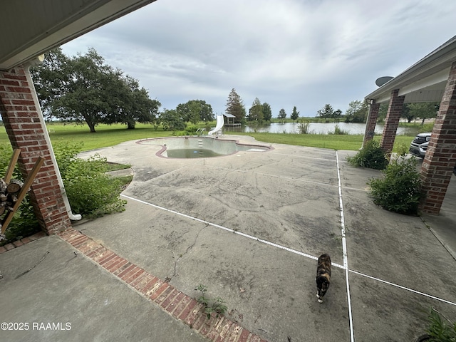 14439 Gladu Rd, Kaplan, LA 70548 - view of patio / terrace with a water view and an outdoor pool