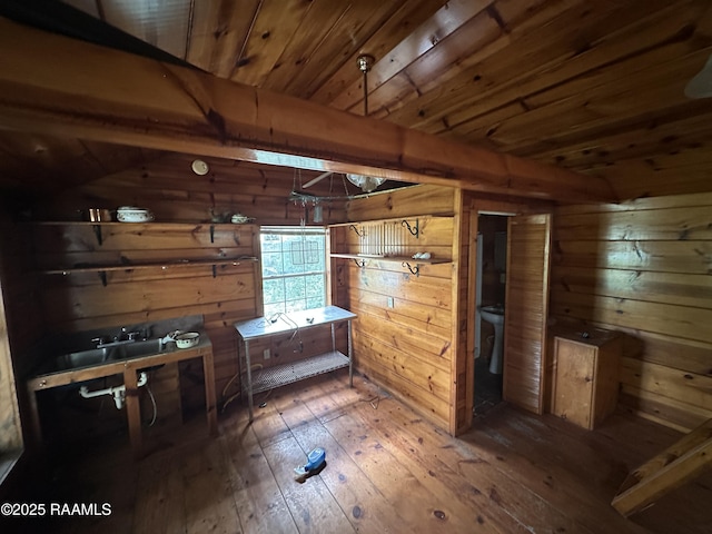 14439 Gladu Rd, Kaplan, LA 70548 - kitchen featuring wooden walls, hardwood / wood-style floors, and a wooden ceiling with exposed beams