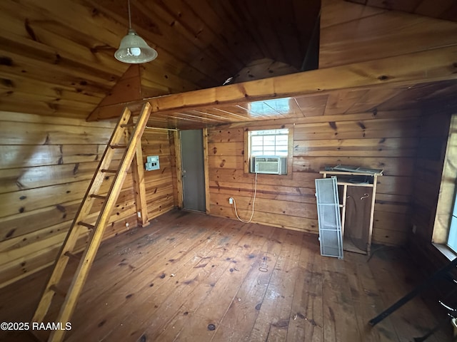 14439 Gladu Rd, Kaplan, LA 70548 - unfurnished bedroom featuring wood-type flooring, wooden walls, vaulted ceiling, wood ceiling, and cooling unit