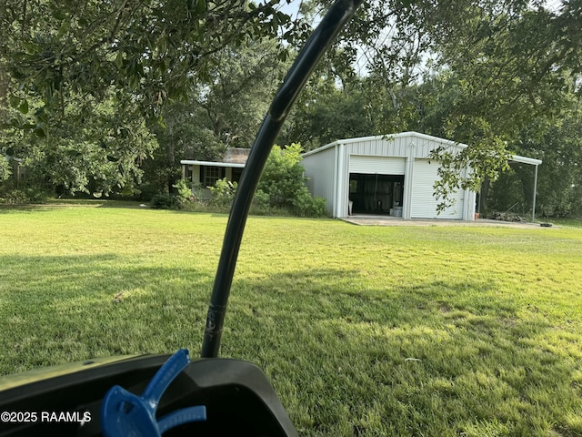 14439 Gladu Rd, Kaplan, LA 70548 - view of grassy yard featuring a garage, an outdoor structure, and view of scattered trees