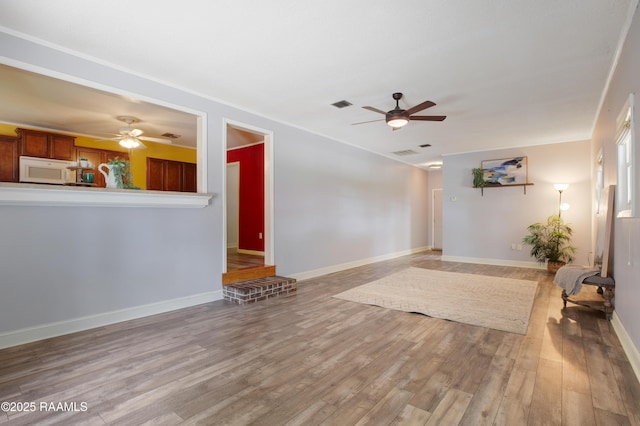 101 Sherry St, Baldwin, LA 70514 - unfurnished living room with a ceiling fan and light wood-style flooring