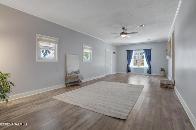 101 Sherry St, Baldwin, LA 70514 - unfurnished living room with a ceiling fan, a textured ceiling, crown molding, and wood finished floors